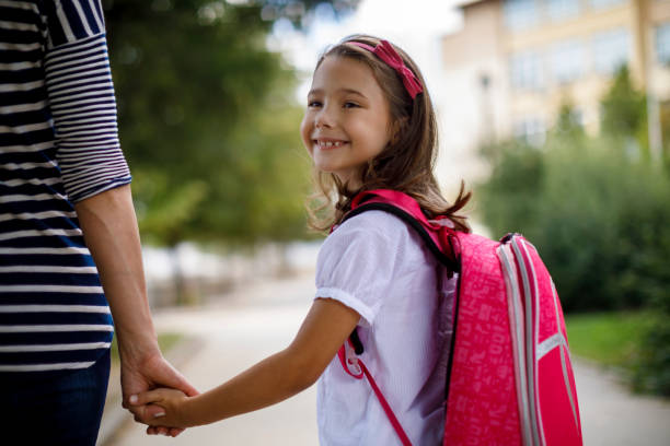 istock Mother taking her daughter to school 1041987630