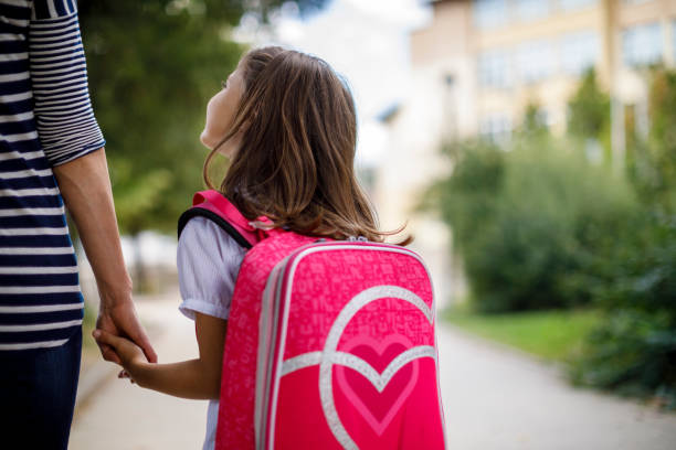 Little school girl is going to school