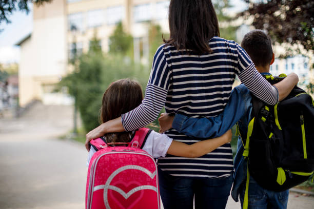 istock Mother taking kids to school 1041987760