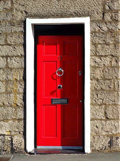istock Red door in stone wall 104199812