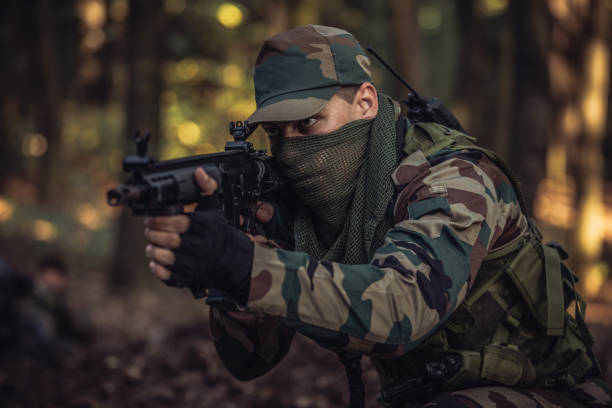 istock Soldier on positin in forest 1042001818