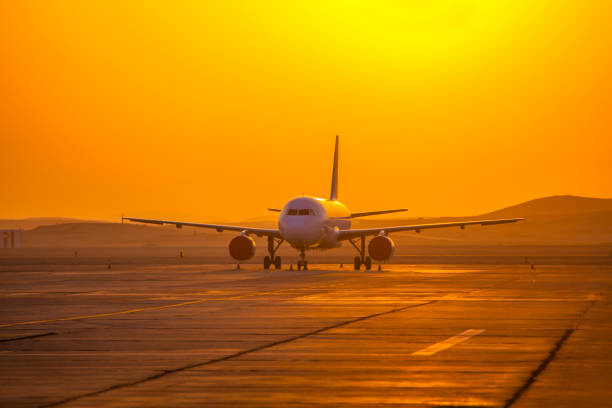 istock plane at the airport at sunrise 1042008654