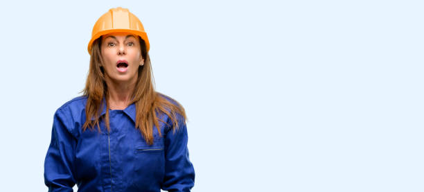 istock Engineer construction worker woman scared in shock, expressing panic and fear 1042010832
