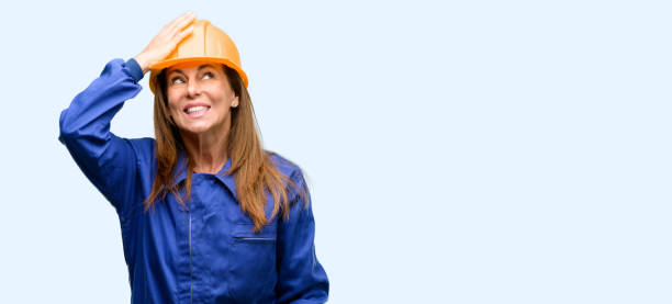 istock Engineer construction worker woman terrified and nervous expressing anxiety and panic gesture, overwhelmed 1042011036