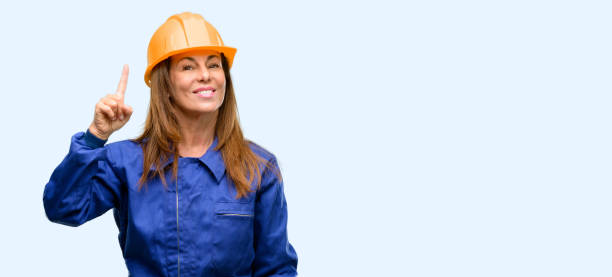 istock Engineer construction worker woman raising finger, the number one 1042011066