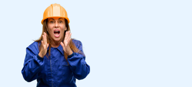 istock Engineer construction worker woman stressful keeping hands on head, terrified in panic, shouting 1042011088