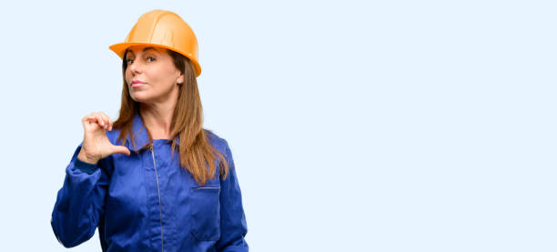 istock Engineer construction worker woman proud, excited and arrogant, pointing with victory face 1042011506
