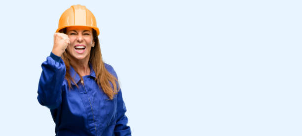 istock Engineer construction worker woman irritated and angry expressing negative emotion, annoyed with someone 1042011508
