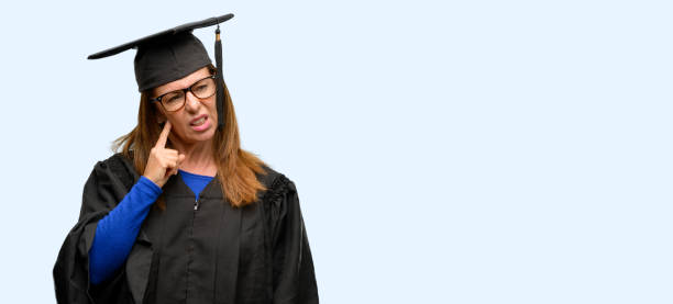 Senior graduate student woman doubt expression, confuse and wonder concept, uncertain future