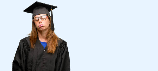 istock Senior graduate student woman with sleepy expression, being overworked and tired 1042016192