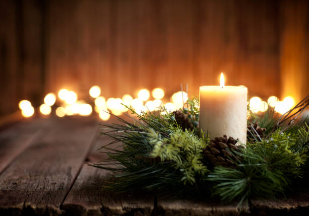 istock Christmas holiday candle on a wood background 1042017226
