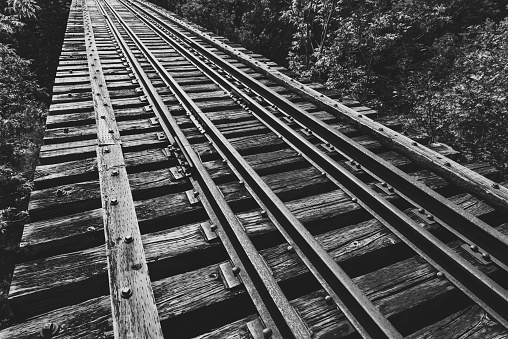 Abandoned railroad bridge spanning a deep valley.