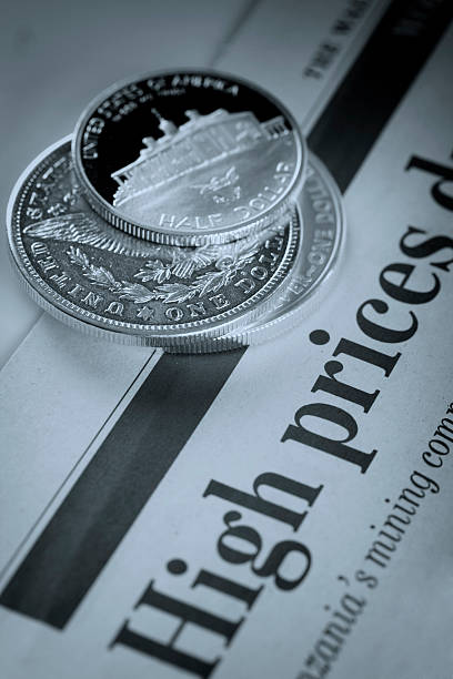 istock dollar coins on financial newspaper 104202023
