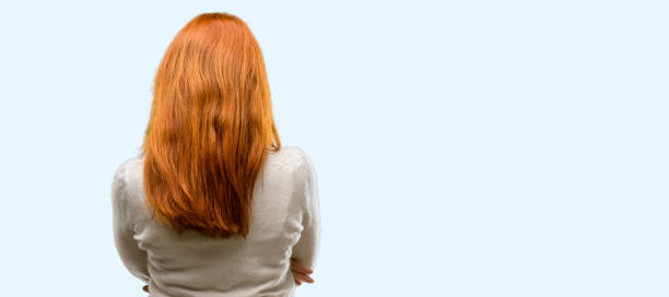 istock Beautiful young redhead woman backside, rear view 1042021386
