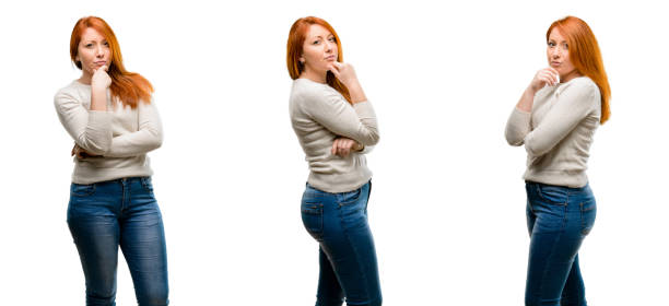 istock Young Beautiful redhead woman thinking thoughtful with smart face 1042021534