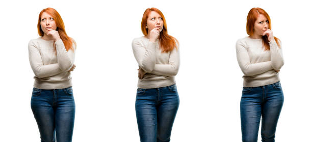 Young Beautiful redhead woman doubt expression, confuse and wonder concept, uncertain future
