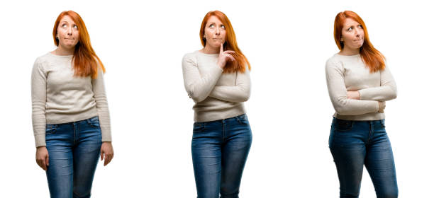 istock Young Beautiful redhead woman doubt expression, confuse and wonder concept, uncertain future 1042021704