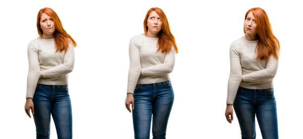 istock Young Beautiful redhead woman doubt expression, confuse and wonder concept, uncertain future 1042021716