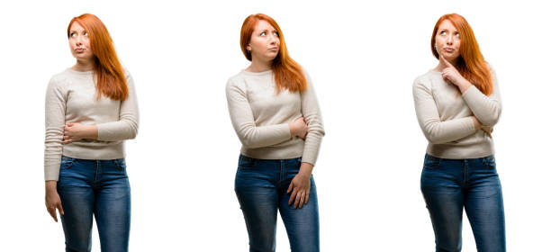 istock Young Beautiful redhead woman doubt expression, confuse and wonder concept, uncertain future 1042021784