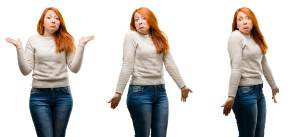 istock Young Beautiful redhead woman doubt expression, confuse and wonder concept, uncertain future 1042021908