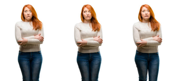 istock Young Beautiful redhead woman nervous and scared biting lips looking camera with impatient expression, pensive 1042021984
