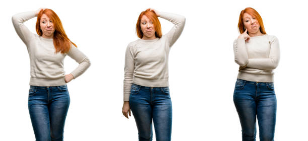 istock Young Beautiful redhead woman doubt expression, confuse and wonder concept, uncertain future 1042022098