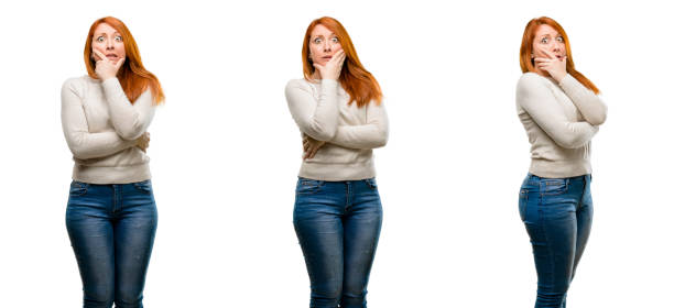 istock Young Beautiful redhead woman scared in shock, expressing panic and fear 1042024920