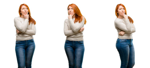 istock Young Beautiful redhead woman thinking thoughtful with smart face 1042024954