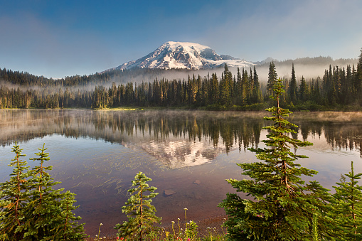 Mt Rainier and Reflection Lake with misty fog rolling through