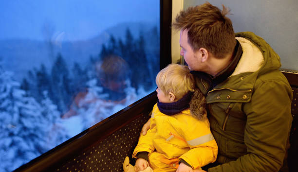 family looking out of the window of train during travel on cogwheel railway/rack railway in alps mountains - rack railway imagens e fotografias de stock