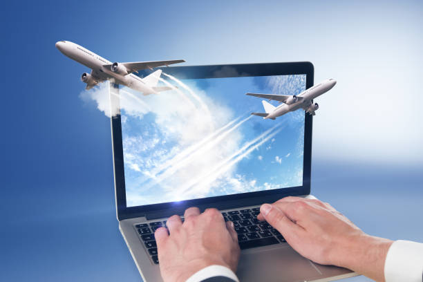 istock man hands and take off planes from laptop 1042026922