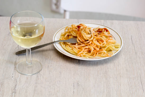 istock pasta and white wine glass 1042034250