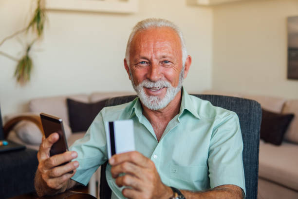 istock Older man shopping online 1042049504