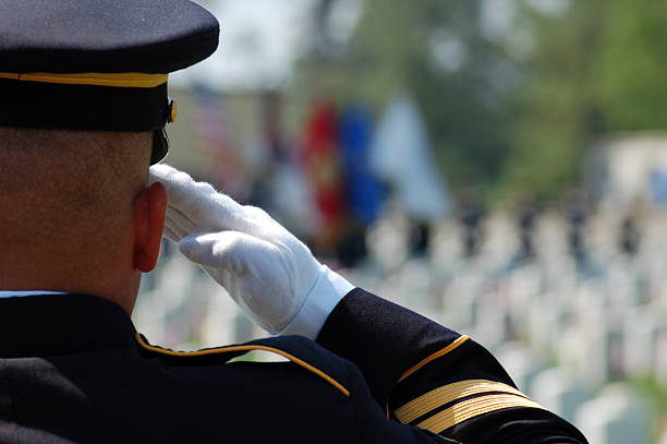 Soldier salutes fallen comrades  us memorial day photos stock pictures, royalty-free photos & images