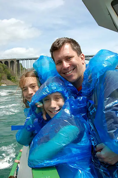 Photo of A picture of a father and his daughters on a boat