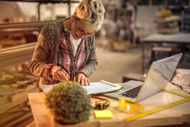 istock Young focused woman industrial engineer taking measures in her workshop. 1042062902