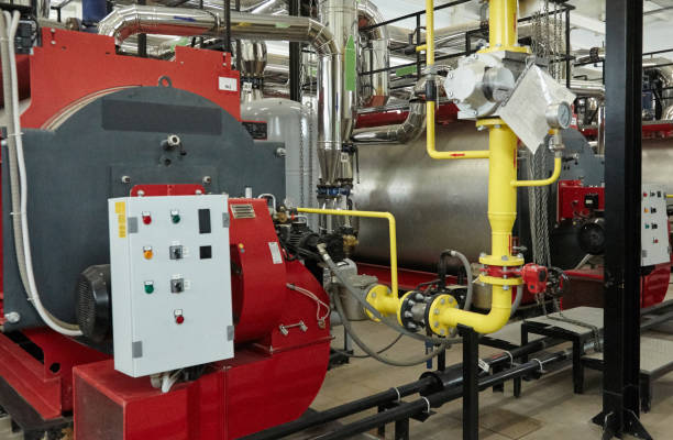 istock Modern new gas heating coppers work in a boiler room. 1042062922