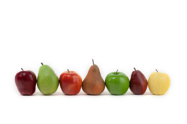 istock An assortment of apples and pears isolated on a white background all lined up 1042062964