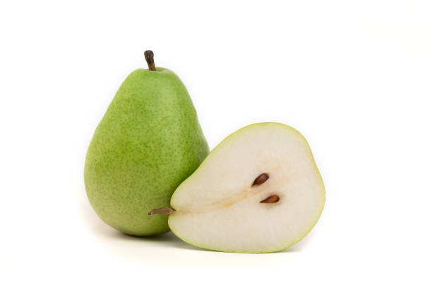 Isolated pear. Two green pears are reflected on the white background.\nSpace for text