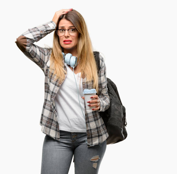 istock Young student woman with headphones and backpack doubt expression, confuse and wonder concept, uncertain future 1042066158