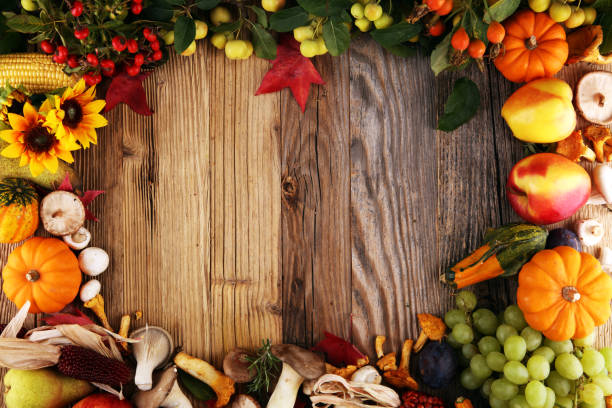istock Autumn nature concept. Fall fruit and vegetables on wood. Thanksgiving dinner 1042078328