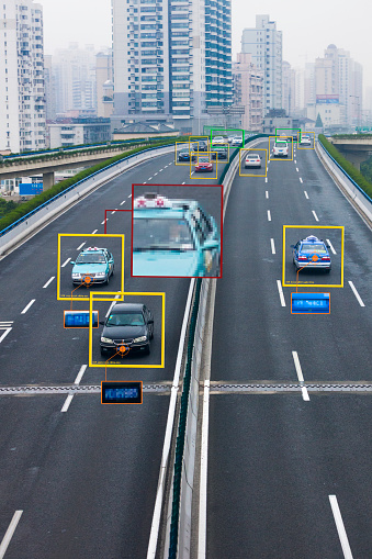 Computer artificial intelligence using facial recognition and automobile information to conduct surveillance in downtown Shanghai, China.