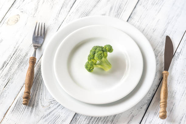 istock Fresh broccoli on the white plate 1042087954