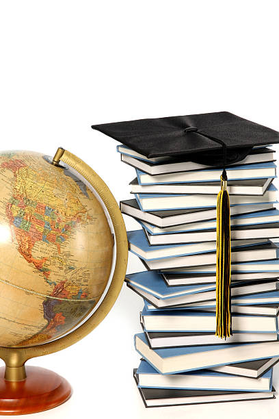 istock Antique globe, graduation cap and books 104211617