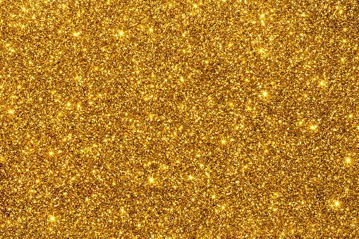 Golden glitter con textura o fondo. photo