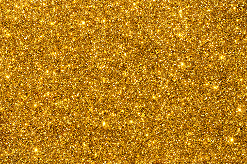 Gold shimmering glitter for texture or background