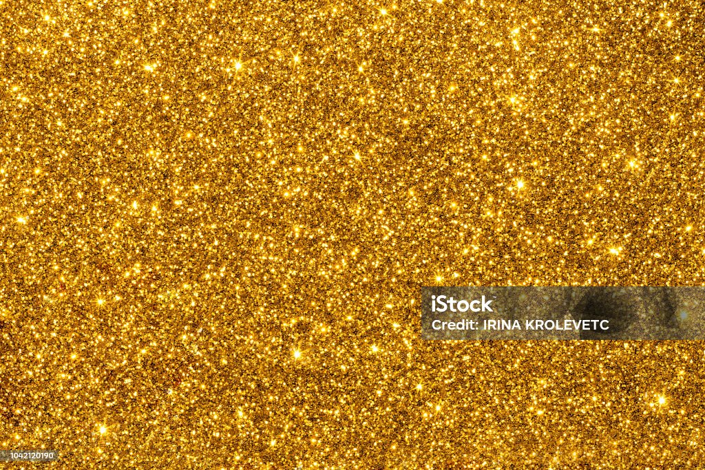 Golden glitter for texture or background Gold shimmering glitter for texture or background Gold - Metal Stock Photo
