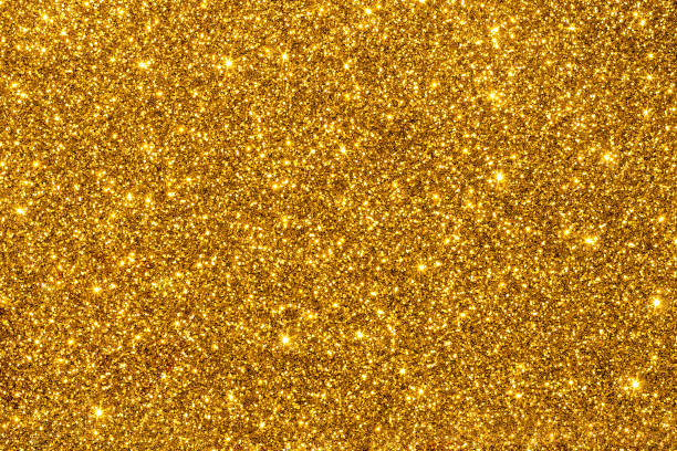 golden glitter for texture or background - purpurina imagens e fotografias de stock