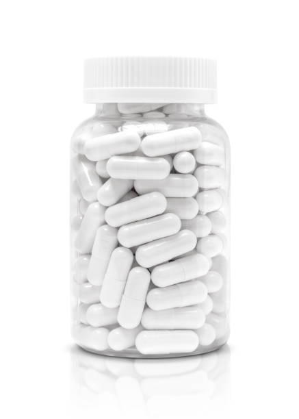 medicina bianca o capsule di integratore in bottiglia di plastica trasparente - drug bottle foto e immagini stock