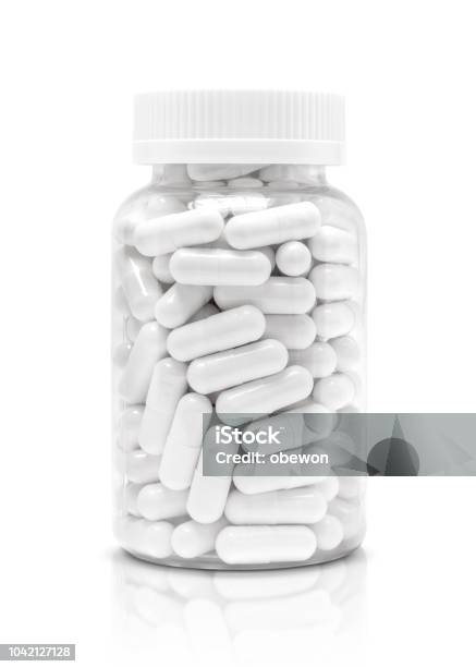 White Medicine Or Supplement Capsules In Transparent Plastic Bottle Stock Photo - Download Image Now